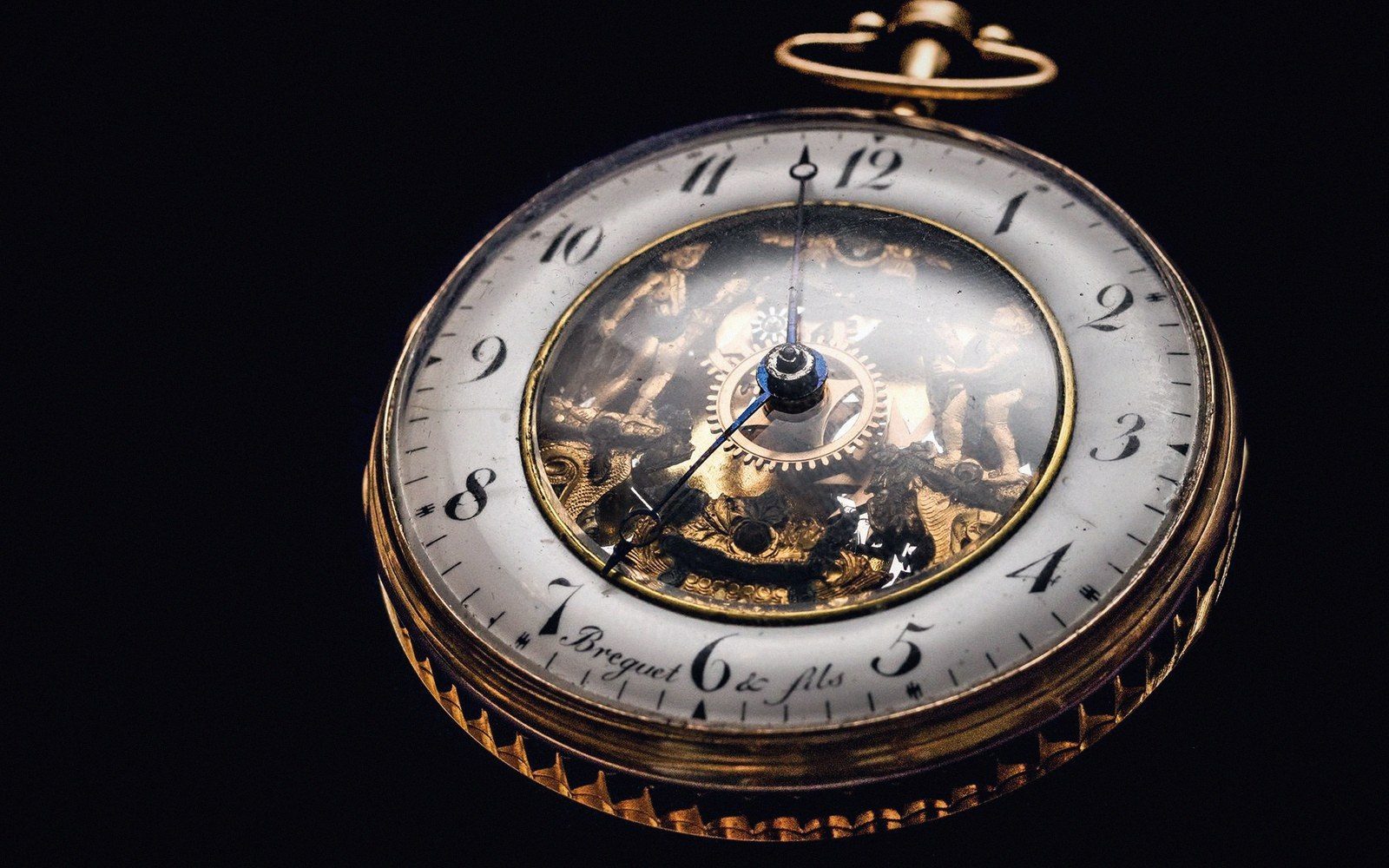 Antique gold pocket watch with exposed skeleton movement and Breguet & fils inscription on the dial
